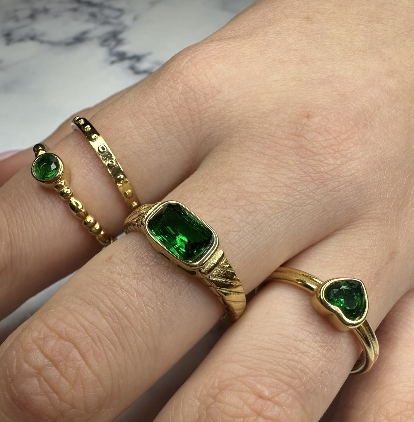 Charmin's Gold-Colored Ring with Green Round Stone R1508 &ndash; Playful and Elegant