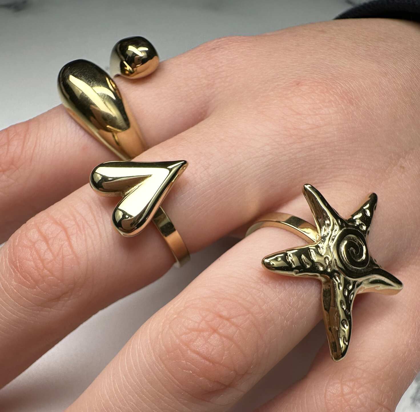 Charmin's Gold-Tone Chunky Heart-Shaped Steel Ring R R1845 &ndash; Modest and elegant.