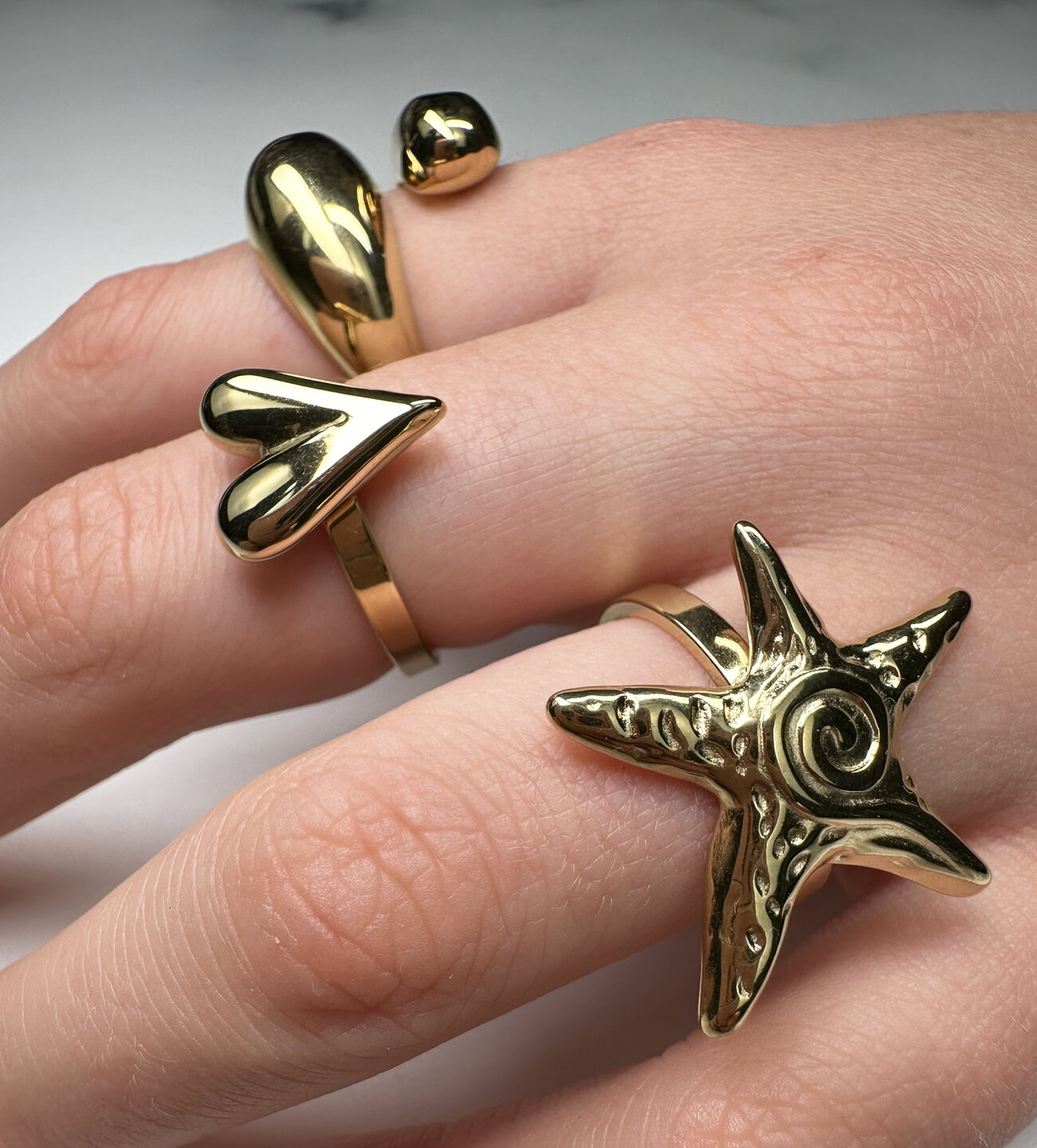 Charmin's Gold-Tone Chunky Heart-Shaped Steel Ring R R1845 &ndash; Modest and elegant.