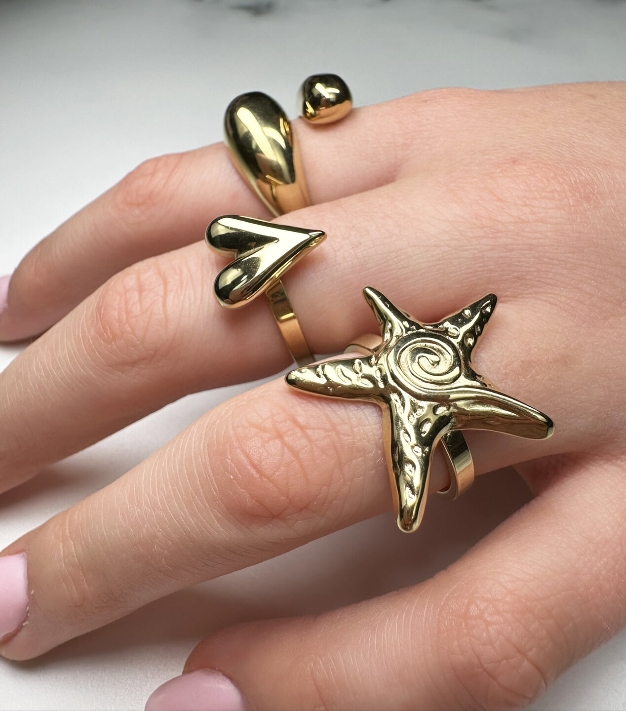 Charmin's Gold-Tone Chunky Heart-Shaped Steel Ring R R1845 &ndash; Modest and elegant.